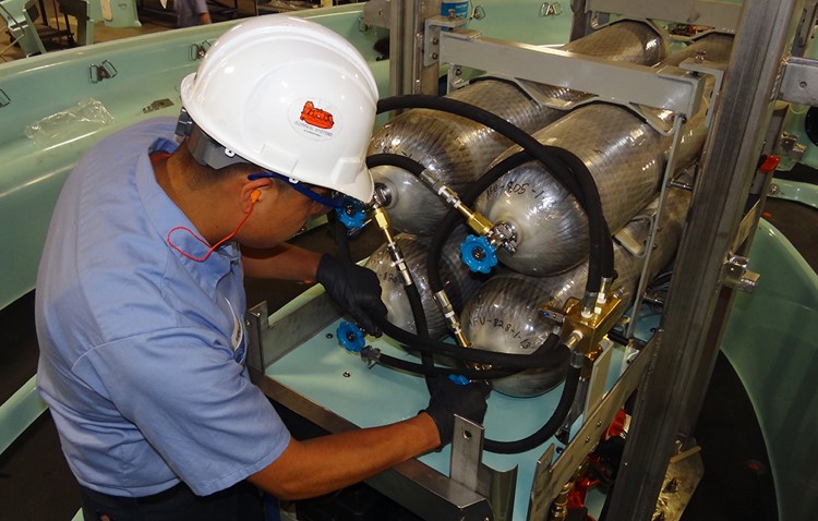 technician with cylinders lifeboat technician